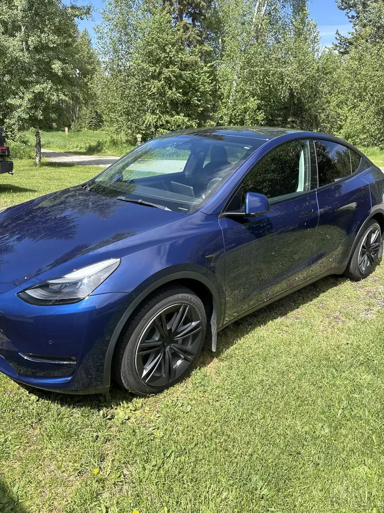 Amazon customer dark Tesla with a glossy outdoor finish